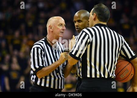 Iowa City, Iowa, USA. 3rd Dec, 2013. December 3, 2013: Game referees confer on a call during the non-conference Big Ten ACC Basketball Challenge Game between the University of Notre Dame Fighting Irish and the University of Iowa Hawkeyes played in Iowa City, Ia. Iowa won, 98-93. © csm/Alamy Live News Stock Photo