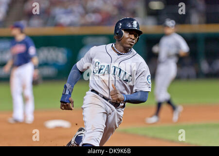 Aug. 23, 2011 - Cleveland, Ohio, U.S - Seattle left fielder Trayvon Robinson (12) digs for third base during the game against Cleveland.  The Seattle Mariners defeated the Cleveland Indians 12-7 at Progressive Field in Cleveland, Ohio. (Credit Image: © Frank Jansky/Southcreek Global/ZUMAPRESS.com) Stock Photo