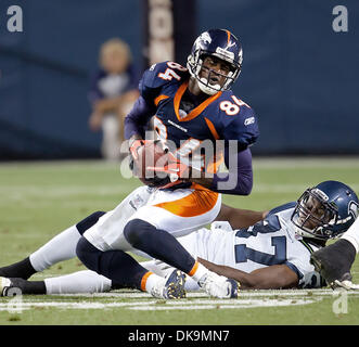 Aug. 27, 2011 - Denver, Colorado, U.S. - Broncos WR BRANDON LLOYD (84) makes a catch during the Denver Broncos Pre-Season game against the Seattle Seahawks at Sports Authority Field at Mile High in Denver, Colorado. The Broncos win the game 23-20 over the Seahawks. (Credit Image: © Hector Acevedo/ZUMAPRESS.com) Stock Photo