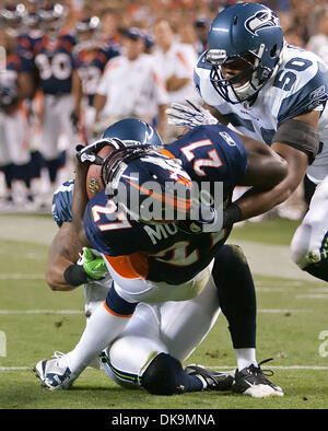 Aug. 27, 2011 - Denver, Colorado, U.S. - Broncos RB KNOWSON MORENO gets tackled during the Denver Broncos Preseason game against the Seattle Seahawks at Sports Authority Field at Mile High in Denver, Colorado. The Broncos win the game 23-20 (Credit Image: © Hector Acevedo/ZUMAPRESS.com) Stock Photo