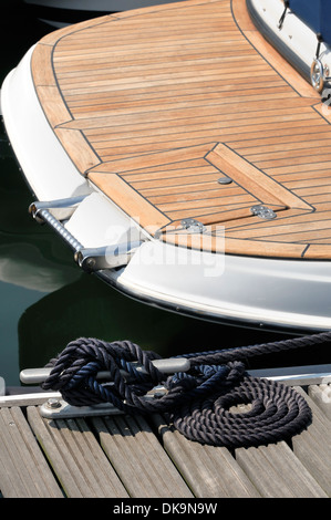 Detail of a rope tied up to bitt securing boat to jetty Stock Photo