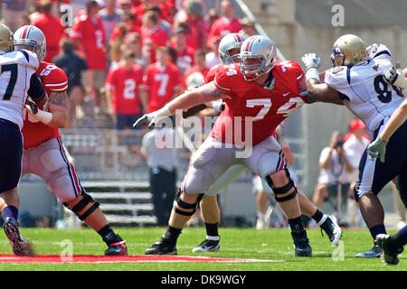 Sept. 3, 2011 - Columbus, Ohio, U.S - Ohio State Buckeyes offensive lineman Jack Mewhort (74) holds off Akron Zips defensive end John Griggs (90) on a block during the first quarter of the game between Akron and Ohio State at Ohio Stadium, Columbus, Ohio.  Ohio State defeated Akron 42-0. (Credit Image: © Scott Stuart/Southcreek Global/ZUMAPRESS.com) Stock Photo