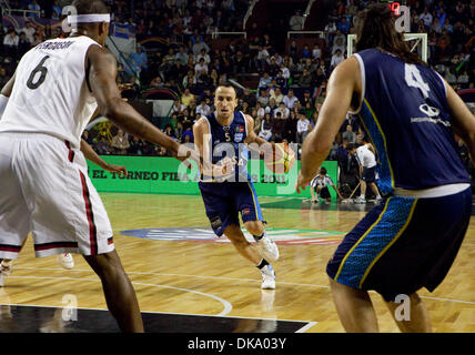 Sep 5, 2011 - Mar del Plata, Buenos Aires, Argentina - San Antonio Spurs and Argentina's MANU GINOBILI dribbles towards Canada's JEFFREY FERGUSON and Argentina's LUIS SCOLA during the FIBA Americas 2011 basketball match between Argentina and Canada. Argentina won the match 79-53. The FIBA event is a qualifying event for the 2012 Olympics in London, with only two places available. ( Stock Photo
