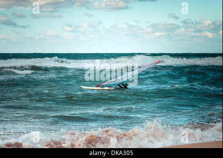 Sea Windsurfing Sport sailing water active leisure Windsurfer training on waves summer day Stock Photo