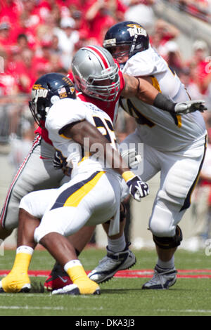 Ohio State defensive lineman Mike Hall, right, sacks Maryland ...