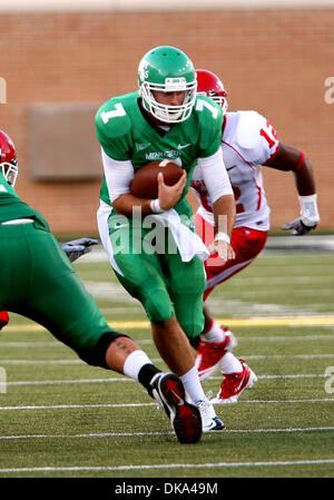 Sept. 10, 2011 - Austin, Texas, United States of America - North Texas Mean Green quarterback Derek Thompson (7) takes the ball upfield through the defense during the game between North Texas Mean Green and the Houston Cougars at Apogee Stadium in Denton, Texas. (Credit Image: © Matt Pearce/Southcreek Global/ZUMAPRESS.com) Stock Photo