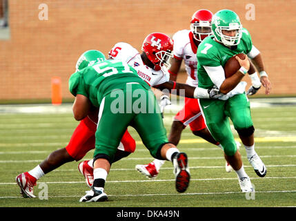 Sept. 10, 2011 - Austin, Texas, United States of America - North Texas Mean Green quarterback Derek Thompson (7) takes the ball upfield through the defense during the game between North Texas Mean Green and the Houston Cougars at Apogee Stadium in Denton, Texas. (Credit Image: © Matt Pearce/Southcreek Global/ZUMAPRESS.com) Stock Photo