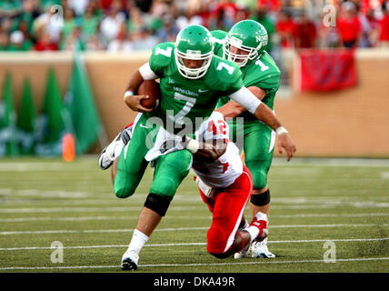 Sept. 10, 2011 - Austin, Texas, United States of America - North Texas Mean Green quarterback Derek Thompson (7 takes the ball upfield through the defense during the game between North Texas Mean Green and the Houston Cougars at Apogee Stadium in Denton, Texas. (Credit Image: © Matt Pearce/Southcreek Global/ZUMAPRESS.com) Stock Photo