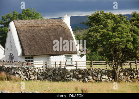 Traditional Old Irish Cottage with a thatched roof in Connemara, Co. Galway, Ireland Stock Photo