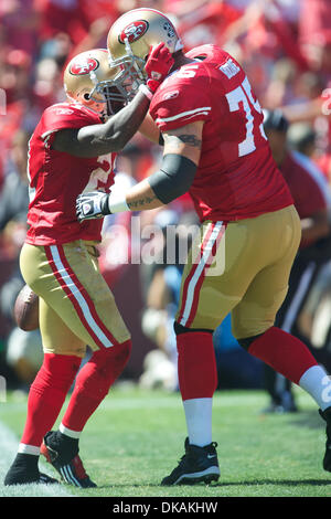 Sept. 18, 2011 - San Francisco, California, U.S - 49ers running back Frank Gore (21) and 49ers offensive tackle Alex Boone (75) celebrate after Gore's first-quarter touchdown during the NFL game between the Dallas Cowboys and the San Francisco 49ers at Candlestick Park in San Francisco, CA.  The Cowboys beat the 49ers 27-24 in overtime. (Credit Image: © Matt Cohen/Southcreek Global Stock Photo