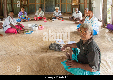 The ceremony of Sevusevu with Chief Besi. Presenting kava for two visiting yachts is Tai Kelekele (foreground). Fulaga Laus Fiji Stock Photo