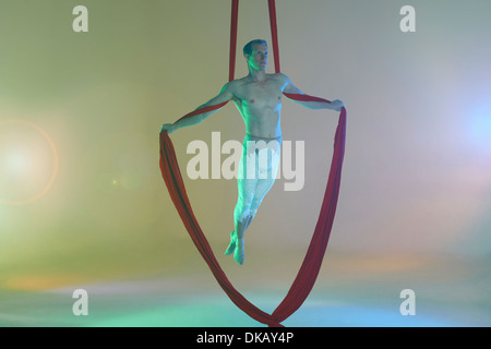 Aerial dancer with red ribbon Stock Photo - Alamy