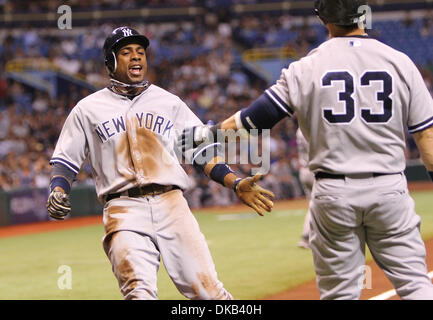 Sept. 28, 2011 - St.Petersburg, Florida, U.S - New York Yankees center fielder Curtis Granderson (14) celebrates with outfielder Nick Swisher (33) after scoring off a hit by New York Yankees second baseman Robinson Cano (24) in the first inning during a Major League Baseball game between the Tampa Bay Rays and the New York Yankees at Tropicana Field. (Credit Image: © Luke Johnson/S Stock Photo