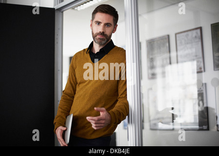 Casual businessman in doorway Stock Photo