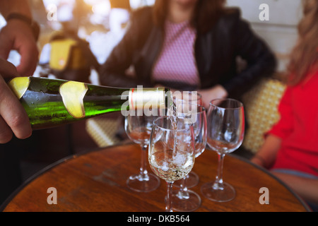 friends drinking wine in the restaurant Stock Photo