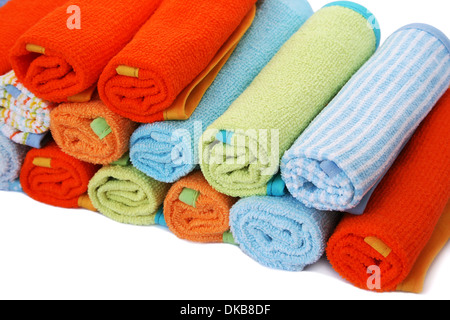 Stack of colorful towels on white background. Stock Photo
