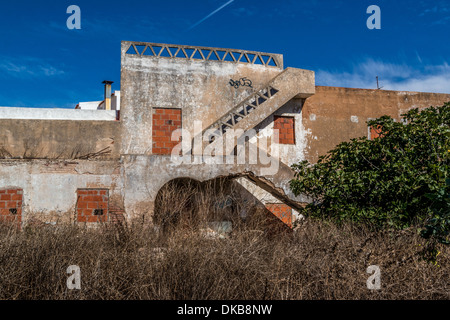 Bricked up building in a state of disrepair and abandoned Stock Photo