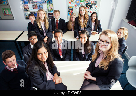 Group portrait of teenage schoolchildren in class Stock Photo