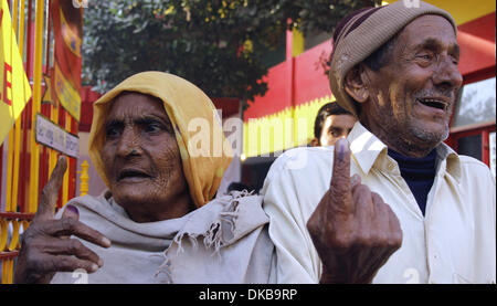 New Delhi, India . 04th Dec, 2013.  A couple shows their fingers with indelible ink after casting their votes at a polling booth in New Delhi, India, Dec. 4, 2013. The Indian capital on Wednesday went to assembly polls in which some 10 million residents are eligible to exercise their franchise to choose a new government for the state. Credit:  Xinhua/Alamy Live News Stock Photo