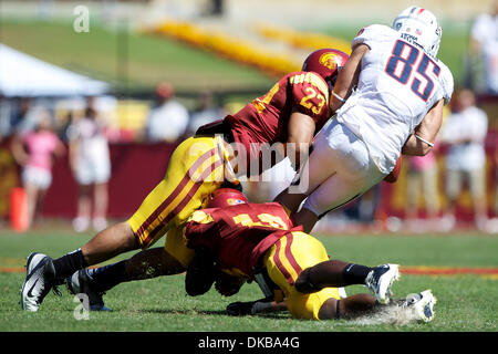 Oct. 1, 2011 - Los Angeles, California, United States of America - wide receiver Victor Blackwell (85) of the USC Trojans is tackled by linebacker Shane Horton (23) of the USC Trojans and linebacker Dion Bailey (18) of the USC Trojans, during a Pac-12 match up between the visiting Arizona Wildcats and the University of Southern California Trojans at the Los Angeles Memorial Coliseu Stock Photo