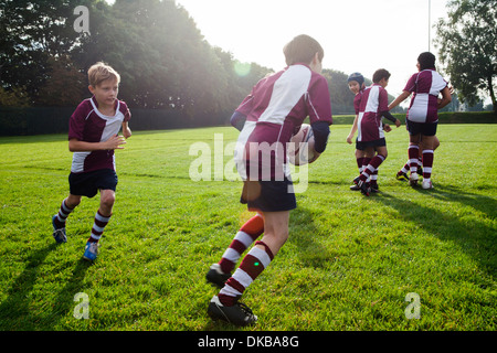 Teenage schoolboy rugby team in practice Stock Photo