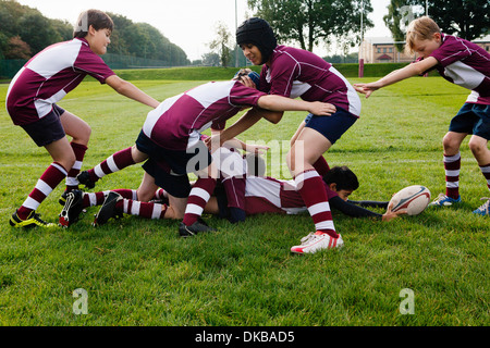 Teenage schoolboy rugby team practicing Stock Photo