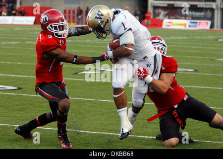 Oct. 1, 2011 - Salt Lake City, Utah, U.S - University of Washington tailback Chris Polk (1) is downed by the Utah defensive line in the first half in Rice-Eccles Stadium in Salt Lake City, Utah. (Credit Image: © Stephen Holt/Southcreek/ZUMAPRESS.com) Stock Photo