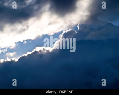 a part of sunny sky between storm clouds Stock Photo