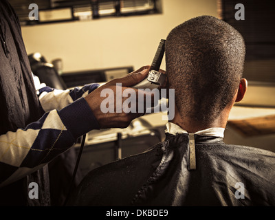 Man having haircut at barber shop Stock Photo