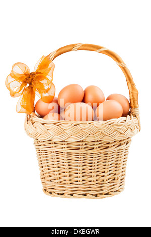 brown eggs in a basket, isolated on white Stock Photo