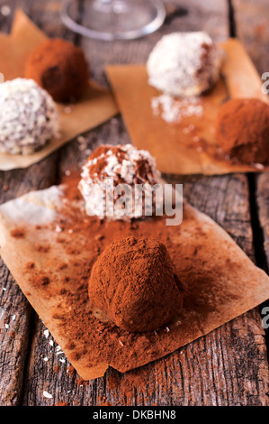 Chocolate truffles with chopped nuts.Selective on the front truffle Stock Photo