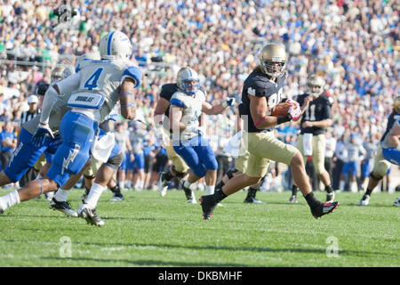 Oct. 8, 2011 - South Bend, Indiana, U.S - Notre Dame tight end Tyler Eifert (#80) runs for yardage after the catch as Air Force defensive back Anthony Wooding Jr. (#4) defends in action during NCAA football game between Notre Dame and Air Force.  The Notre Dame Fighting Irish defeated the Air Force Falcons 59-33 in game at Notre Dame Stadium in South Bend, Indiana. (Credit Image: © Stock Photo