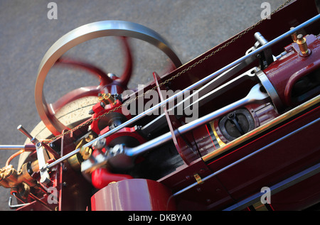 Flywheel and close up of moving parts of a small traction engine. Stock Photo