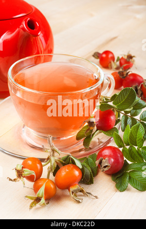 rose hip tea and red teapot Stock Photo