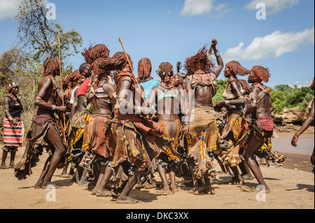 Women dancing during a bull jumping ceremony. A rite of passage from boys to men. Hamer tribe, Omo valley, Ethiopia Stock Photo