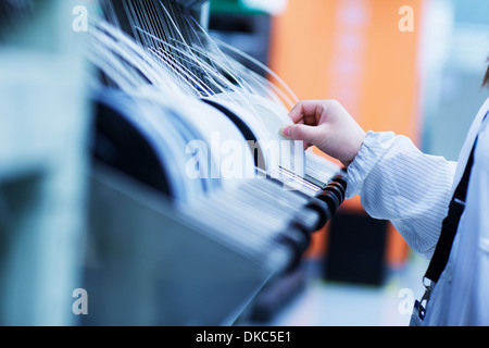 Worker at small parts manufacturing factory in China Stock Photo