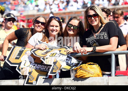 Oct. 15, 2011 - Dallas, Texas, United States of America - A few UCF Knights fans cheer for their team during the game between SMU Mustangs and the UCF Knights at Ford Stadium in Dallas, Texas. SMU beat UCF 38-17. (Credit Image: © Matt Pearce/Southcreek/ZUMAPRESS.com) Stock Photo