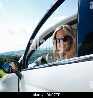 Mature woman sitting in car Stock Photo