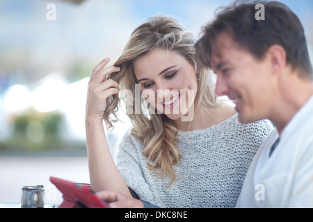 Couple looking at digital tablet Stock Photo