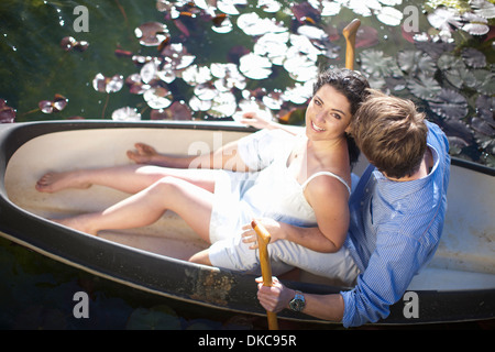 Young couple having fun in rowing boat Stock Photo