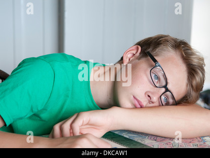 Portrait of teenage boy looking bored Stock Photo
