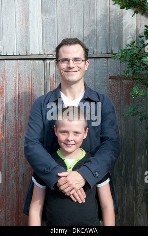 Portrait of father and son in garden Stock Photo