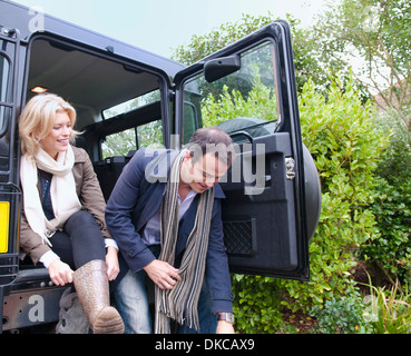 Mid adult couple preparing for country walk Stock Photo