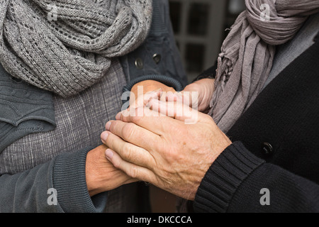 Senior couple holding hands, close up Stock Photo