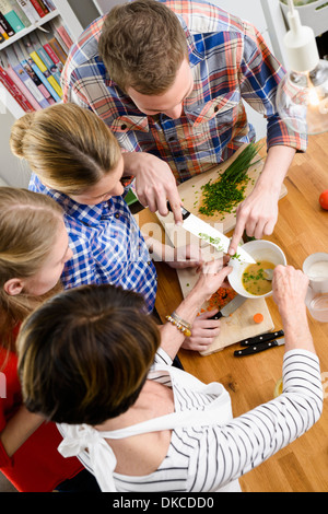Mother, daughters and son preparing food, high angle Stock Photo