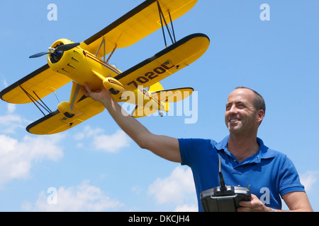 Man preparing to launch model plane Stock Photo