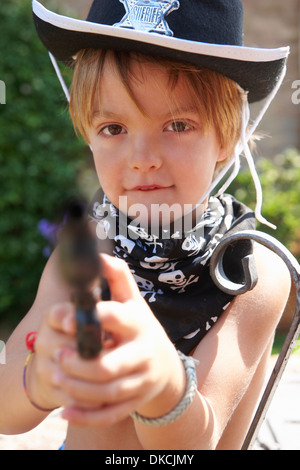 Boy in sheriff hat with gun Stock Photo