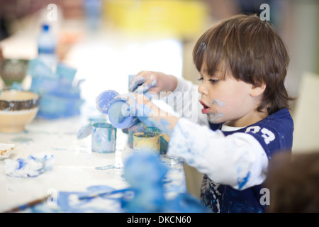Toddler concentrating in art class Stock Photo