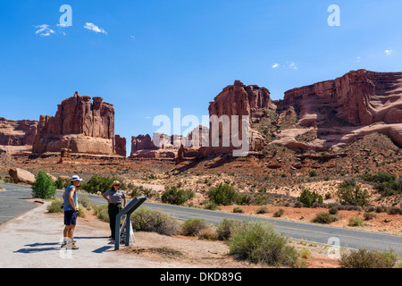 Tourists talking to a park ranger at Courthouse Towers viewpoint, Arches National Park, Utah, USA Stock Photo