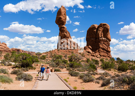 Walkers on the Balanced Rock Trail, Arches National Park, Utah, USA Stock Photo